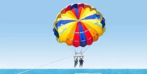 Feel the thrill of parasailing over the sea